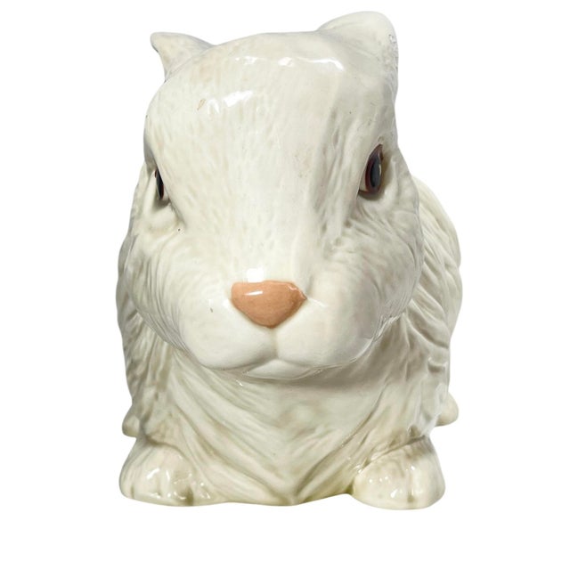 Add a nice touch to your decor with this adorable glazed ceramic rabbit. A scrape visible to the paint and glaze on the...