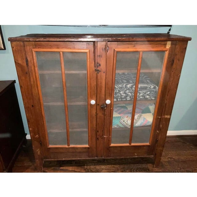 Beautiful 1800's jelly or cheese curing cupboard probably made by Bennett and Rowe. Screen door fronts and sides in...