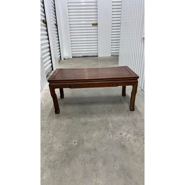 This beautiful rectangular coffee table exudes simplicity reminiscent of the Ming Dynasty period, with a natural wood...