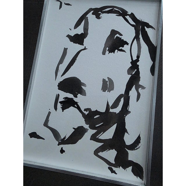 Watercolor of a basset hound in very bold strokes Black on white woven artist’s paper Recently framed in a narrow black...