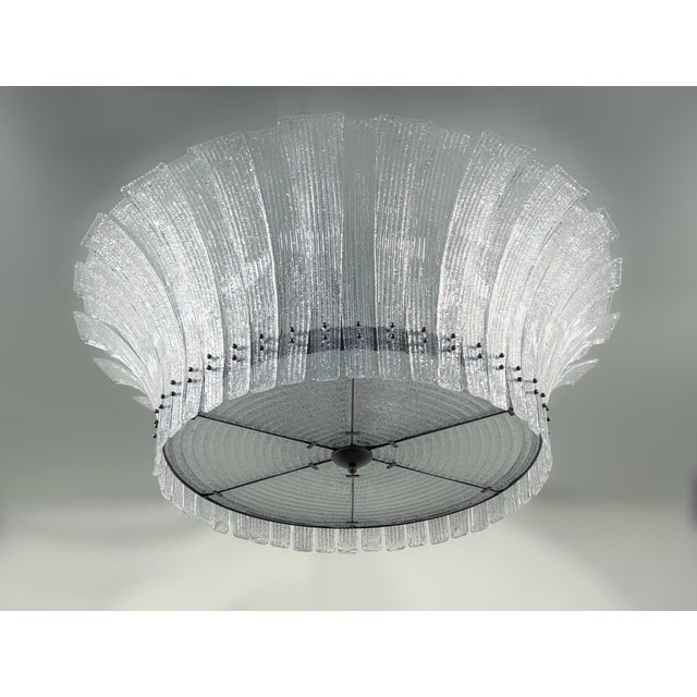 Italian modern flushmount with clear Murano glass leaves hand blown with textured granular effect using Graniglia...