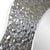 Encased in a bright silver frame with hammered texture, this mirror is equipped with d rings on the back for easy hanging....