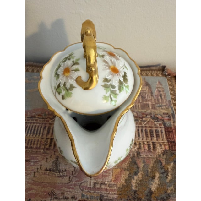 A spectacular, authentic antique French hard-paste porcelain ice water/lemonade pitcher crafted by the prestigious factory...
