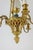 Louis XVI style chandelier in gilded bronze and orange and blue glass paste. French work realized circa 1900. This piece...