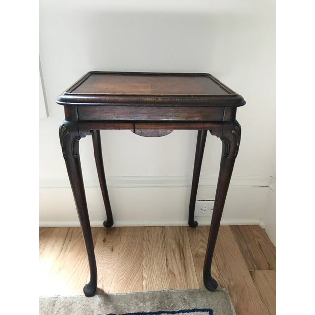 Beautiful little Queen Anne style side table with Cabriole legs with shell and scroll detailing at top. The top of the...