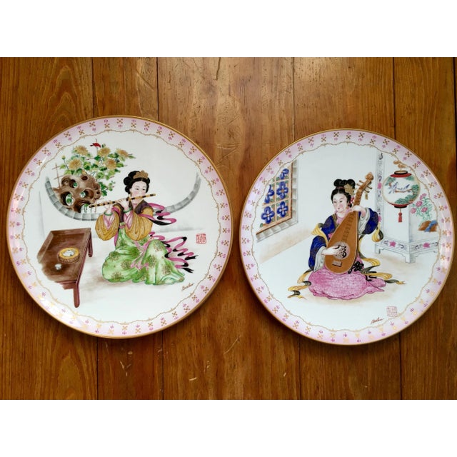 Made in 1984 by Boehm Studios, this lovely pair of porcelain decor plates depicts 2 musical maidens in beautiful attire....