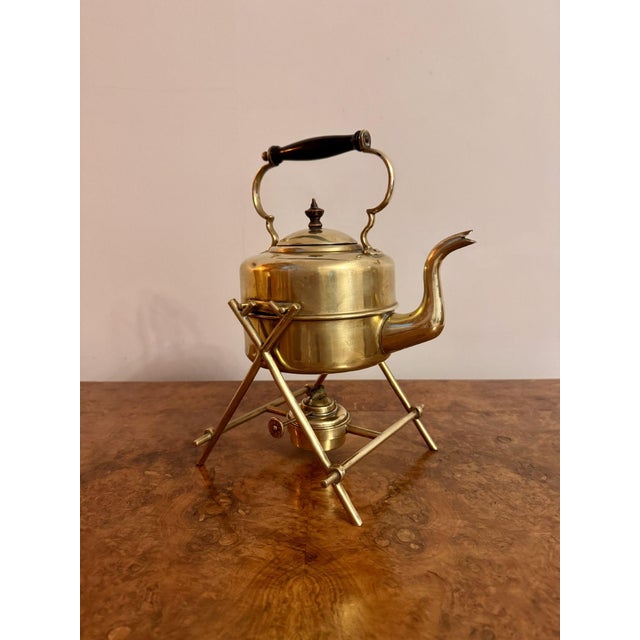 Antique Edwardian quality brass spirit kettle and stand, having a quality brass kettle on the original brass stand above...