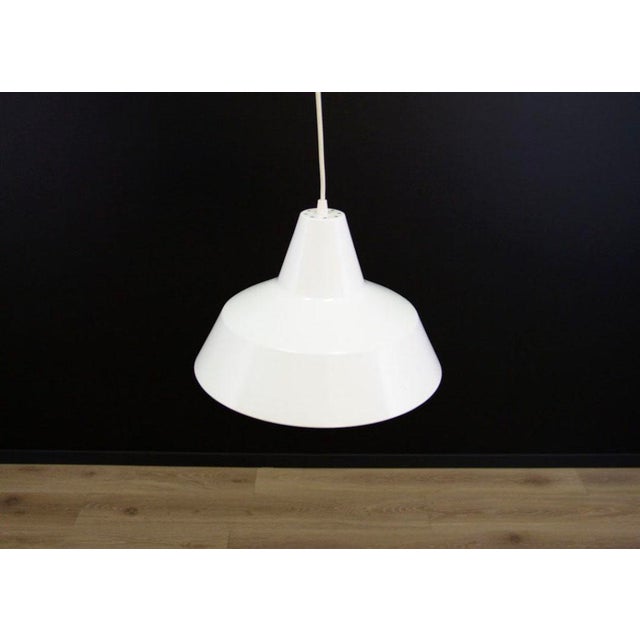 The lamp was made in the 1970s, Danish production. Made of metal in the colour of white. Condition: Lamp in original...