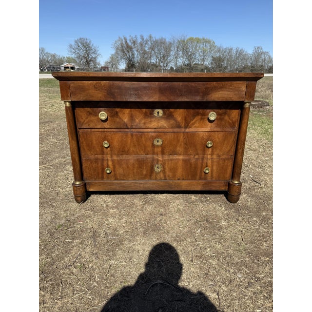 19th Century French Empire Commode from France. Made of walnut, the wood has been finished with a lustrous French polish,...