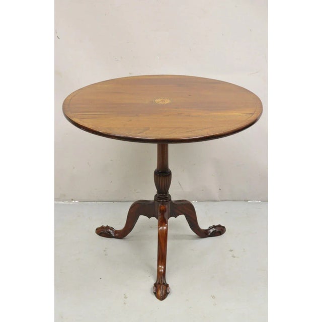 Antique Chippendale Style Round Tilt Top Pinwheel Inlay Ball and Claw Side Table. Item features tapered ball and claw...
