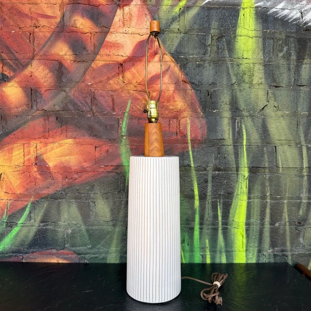 This is a studio made ceramic table lamp designed by Gordon and Jane Martz / Marshall Studios. The lamps feature a...