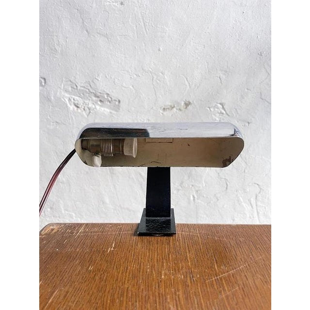This sleek chrome desk lamp exemplifies the Art Deco design movement that flourished in France during the 1920s and 1930s....