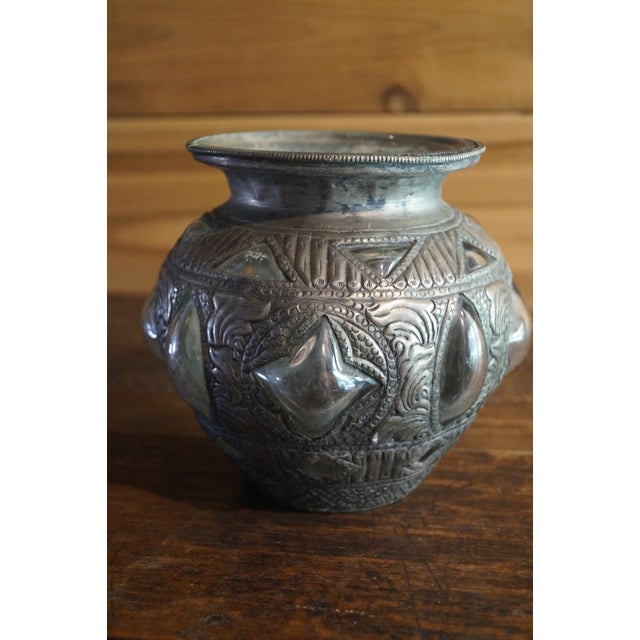 A very cool Rajasthani vase which has an abstract glass, 3 dimensional body which protrudes through its metal encasement....