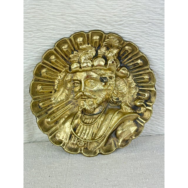 Vintage brass catchall/ashtray depicting a man wearing a feathered hat. This is a pre-owned item so please see all...