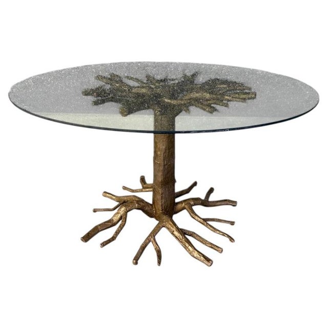 Striking and unique dining tabel in the manner of Duval brasseur with a hand made tree branch base. Made from aluminum and...