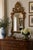 An exceptional late 19th century Italian giltwood mirror with richly carved Rococo detailing and a beautifully aged...