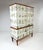 1950’s curved front Swedish Cabinet later papered with illustrations by C.A. Lindman book Nordens Flora. Cabinet consists...