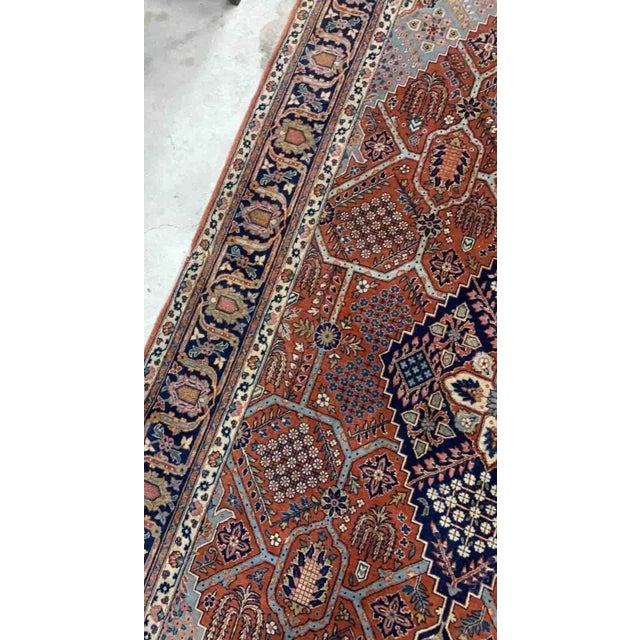 Handmade antique Persian Jozan rug in traditional design with large medallion. The rug is from the beginning of 20th...