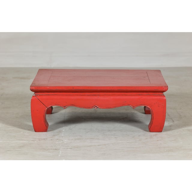 Crafted in solid wood and finished in red lacquer, this low Chinese Kang table brings both historic character and...