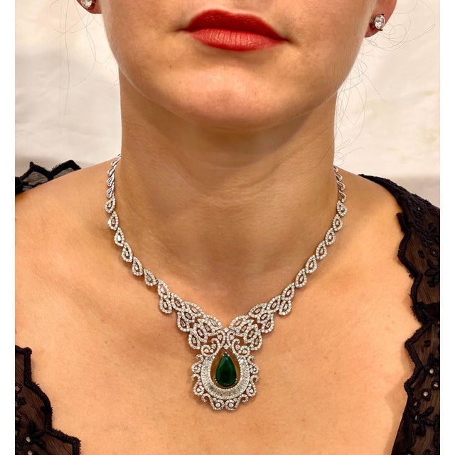 Approximately 11 Ct Pear Shape Zambian Natural Emerald & approximately 17 Ct Diamond Necklace 18 Karat White Gold This...