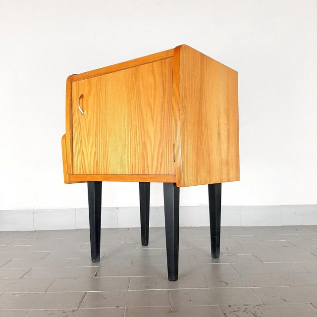 The beautiful bedside table is made in the 70s in Yugoslavia. Made of plywood, chipboard, varnish. It has been preserved...