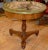 This listing is for an early 19th century Italian fruitwood gueridon or center table with magnificent scagliola top....