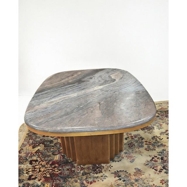 This is a vintage mid-century modern (circa 1960s) marble and teak coffee table by Bendixen, made in Sweden, featuring an...