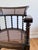 This Edwardian armchair dates from the early 20th century and is made of solid beech. The cane seat and backrest give it a...