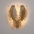 An elegant italian art deco wall sconce, featuring a sculptural composition of murano glass leaves layered in textured...