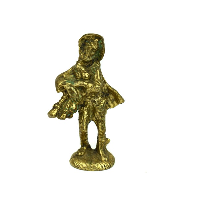 This charming set of two vintage-style brass figurines captures a nostalgic scene of traditional folk life. The first...