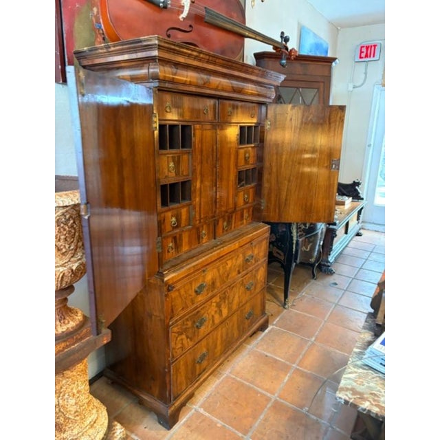 The Antique English Gentlemen's Chest on Chest is a beautifully crafted piece of furniture from the 1820s, made of...