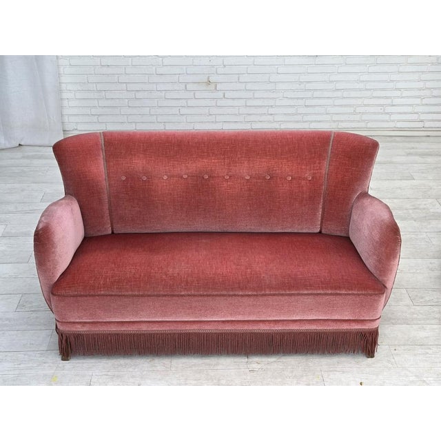 1970s, Danish 2-seater sofa. Original salmon pink furniture velour, oak wood legs, springs in the seat. Original good...