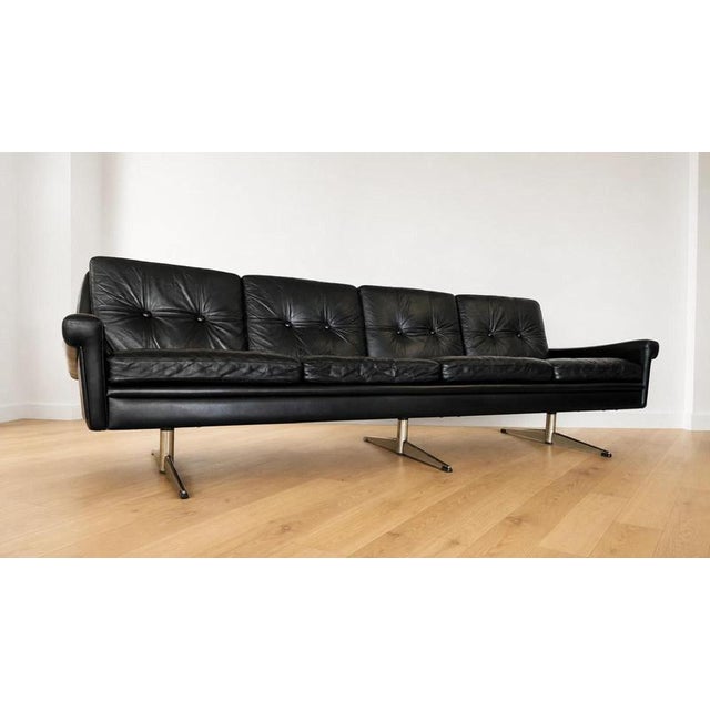 Vintage danish mid-century 4 person svend skipper sofa in black leather crafted in denmark by skipper furniture, this...