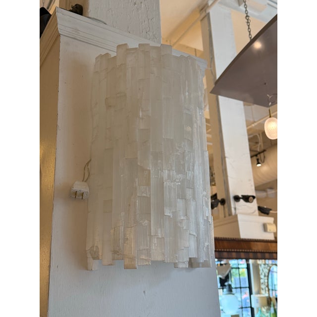 Design Plus Gallery presents a Selenite Wall Sconces. The sconces crystals are arranged in layers, creating a mesmerizing...