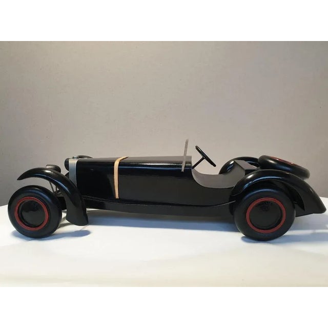 Michel Aroutcheff for Vilac "Mercedes SSKL 1931" car, circa 1987 Wood with Vilac label Size: 35 x 9 x 15 cms