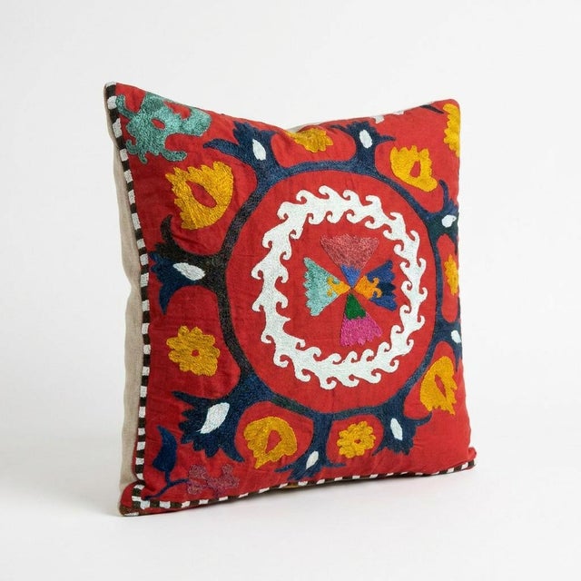 This beautiful 22'' x 25'' hand-embroidered Suzani pillow cover was made from authentic Uzbek cotton fabric. The intricate...