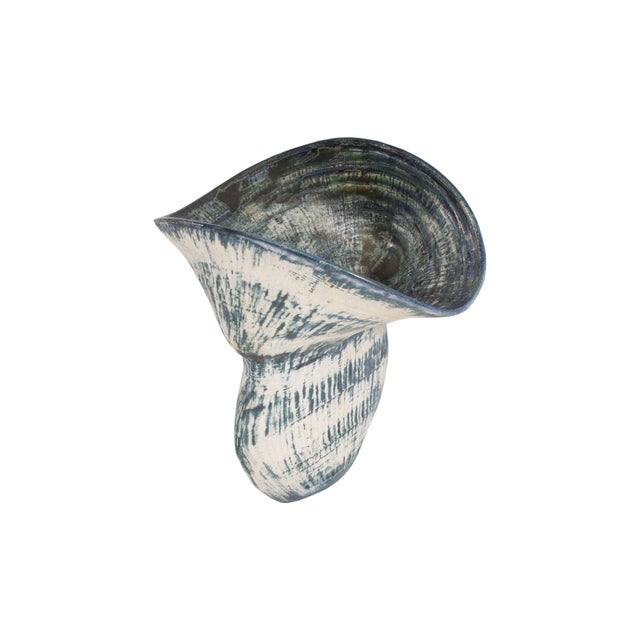 A 1989 studio pottery vase by the American artist Gabriella Verbovsky (born 1964). This blue and white vase has a wide rim...