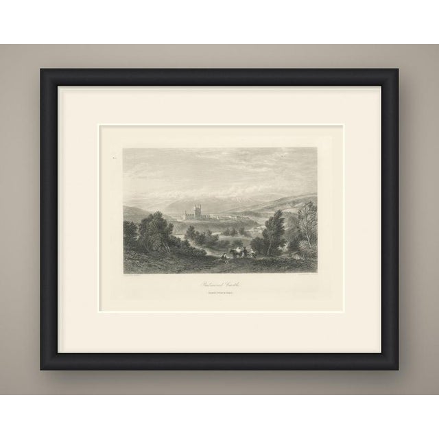 Balmoral castle rises in the middle distance of this broad highland landscape, its turreted tower clear against a range of...