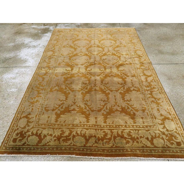 A vintage Indian Lahore accent rug handmade during the Mid-20th century. Measures: 5' 7" x 8' 10"