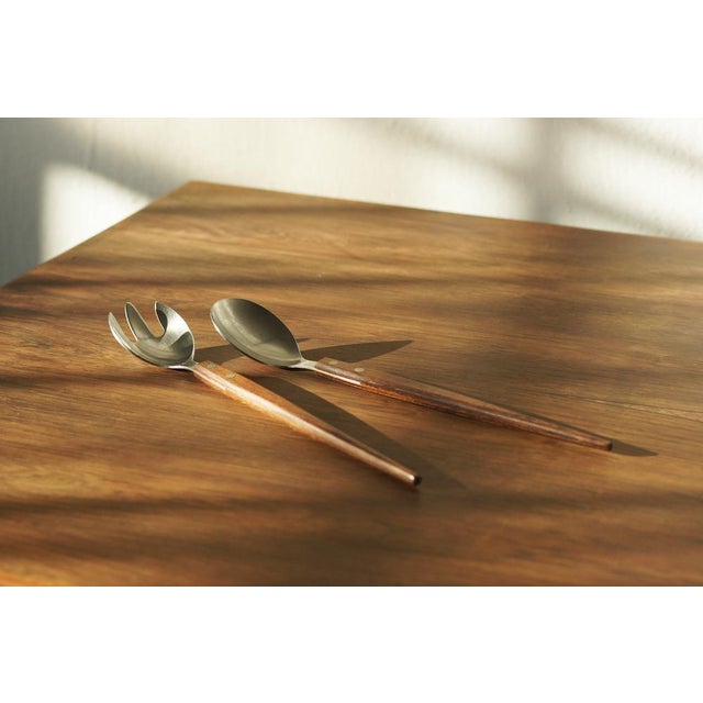 These elegant teak and stainless steel salad servers were manufactured in Denmark in the early 1960s and remain in very...