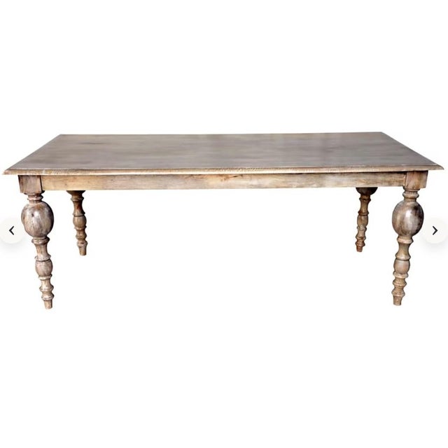 Bring timeless character to your dining space with this solid wood dining table with seating for 6–8. Featuring turned leg...