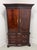 A Chippendale style armoire / linen press made by Thomasville, from their The Mahogany Collection. Mahogany with flame...