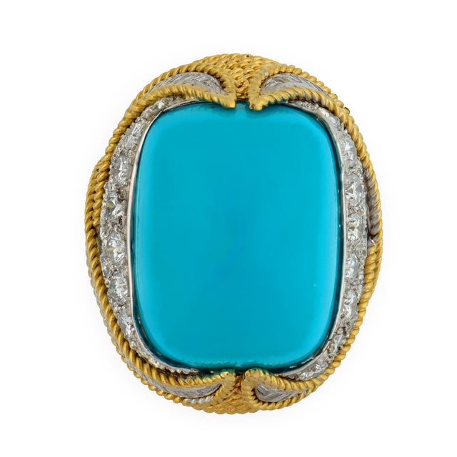 This vintage cocktail ring is a commanding expression of scale, color, and confident design. At its center rests an...