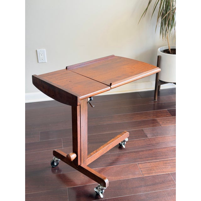 Description (SEO + conversion optimized): Authentic Danish modern rosewood rolling tray table from the 1970s, combining...