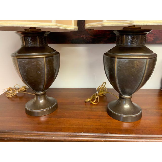 20th century pair of metal urn lamps, hammered finish detail, great angular shades. Base to top of socket measures 20.5”....