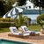 Transform your outdoor space with the MEZE 9 ft crank umbrella, featuring a hunter green stripe canopy and a brown metal...
