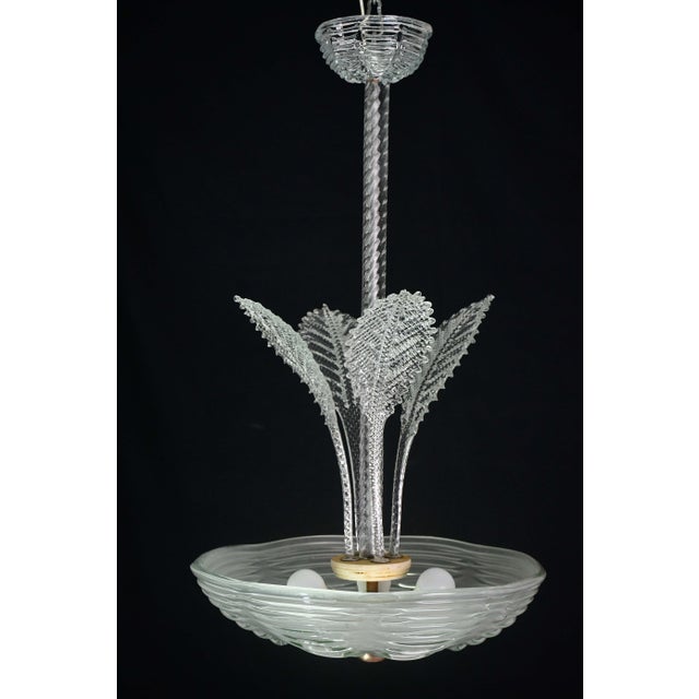 Art Deco chandelier made by the Barovier & Toso glassworks in the 1940s and 1950s. This chandelier's unique feature is the...