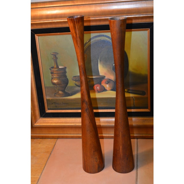 Great looking pair of wooden candlesticks. I believe they are teak. No markings. Felt bases. One is 19" high, other 19...