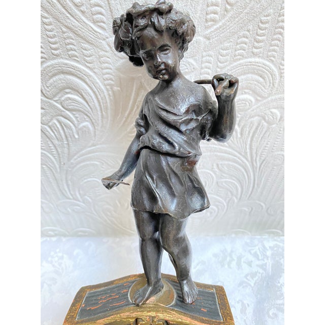 One of a kind bronze figurine on hand painted wood base. I believe it to be of Italian origin given the style of the base....