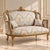 Make a statement with this elegant French-style sofa, featuring luxurious light blue damask upholstery and an intricately...